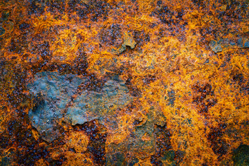Rusty metal surface with shabby background paint. Blue cracked paint texture on an iron sheet. Fragment of an old metal door, Metal corrosion.