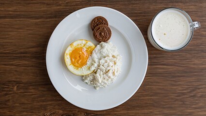 Tasty traditional breakfast including soy milk, arem-arem, serabi, and abuk served on a plate