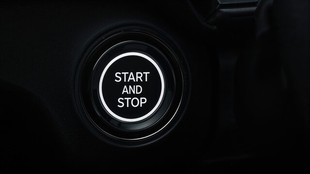 Zoomed-in image of a car's push-button ignition system enabling engine start and stop.