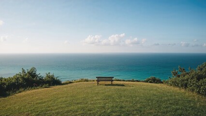 Hill vantage point offering a seaside panorama with a bench
