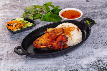 Spicy roasted chicken wing with rice