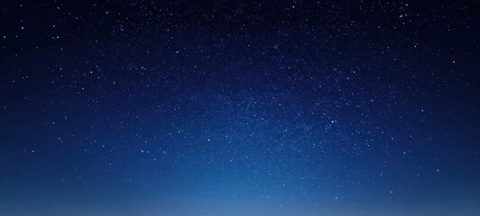Fototapeta premium The serene night sky filled with countless twinkling stars.