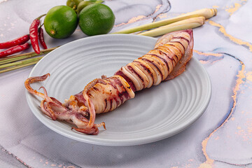 Tasty grilled wild squid with lime
