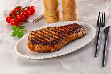 Grilled pork steak with bone