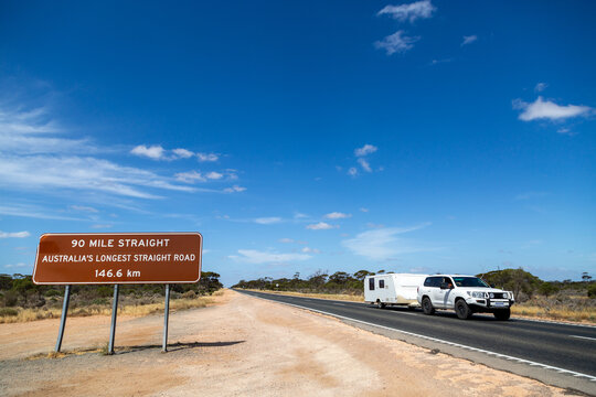 Caravan being towed along the 90 Mile Straight on Eyre Highway on the Nullarbor