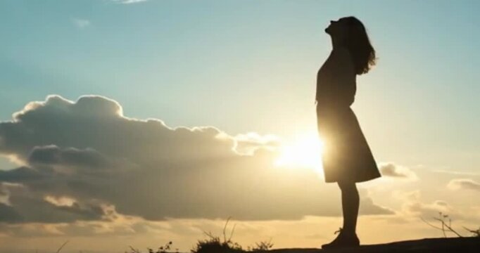 silhouette of a woman in the sunset