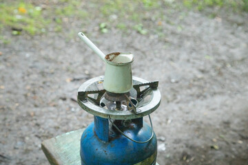 Coffee on the gas burner in outdoor.