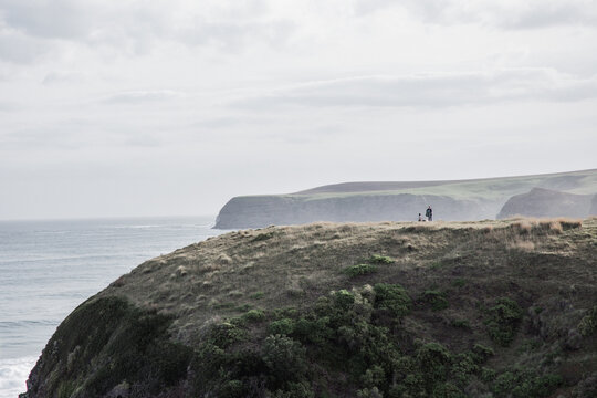 Tiny figure on high cliffs on the mornington peninsula