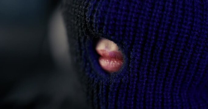 Beautiful Woman with Red Lips Behind Black Ski Mask &ndash; Mysterious Close-Up