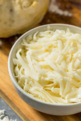 Homemade Shredded Mozzarella Cheese in a Bowl