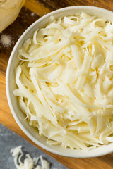 Homemade Shredded Mozzarella Cheese in a Bowl