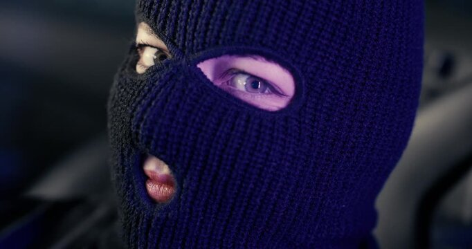 Camera Slowly Zooms in on Blue Eyes of Woman Wearing Black Ski Mask &ndash; Mysterious Close-Up