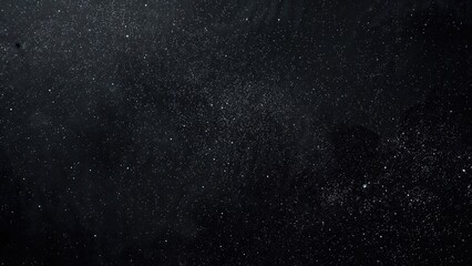 Dark textured backdrop with abstract black surface