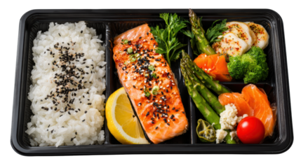 Delicious salmon bento box with rice, vegetables, and lemon, perfect for healthy eating.