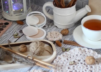 Table different woman objects cup of tea needlework knitting doily beige pastel calm colors cozy photo 