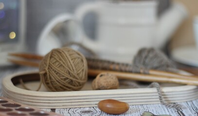 Needlework knitting objects on the table needles and clew ball wool yarn differen woman things...