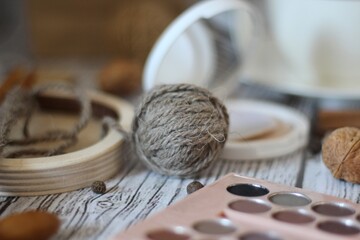 Needlework knitting objects on the table needles and clew ball wool yarn differen woman things...