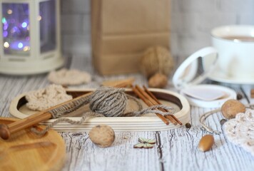  Woman's different things cup of tea, make up, ball clew yarn, mirror doily cozy photo beige pastel light colors