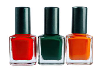 Three nail polish bottles, red, green, and orange, in a row, dark green caps, clear glass