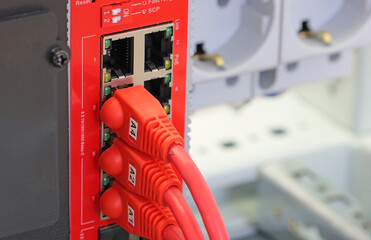 Connecting an Ethernet cable with an Rj45 connector to the equipment in the electrical control...