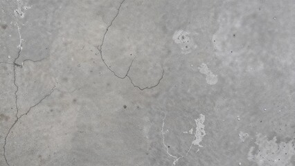 Obraz premium High definition photo showcasing a grey stone texture adorned with tiny scratches and varied dark and light spots