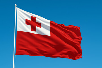 Tonga silk flag waving against clear blue sky during a bright day. Tongan flag - the national symbol of Tonga, Tongan flag at sunrise