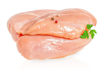 Raw chicken breasts with peppercorns and parsley on a white background