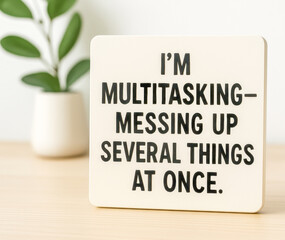 Multitasking is messing up several things at once, funny quote on wooden desk