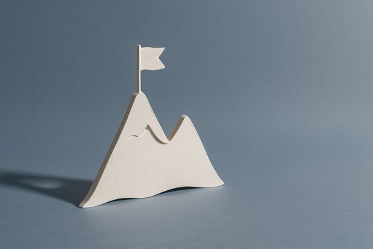 A mountain silhouette with a flag illustrates the concept of achieving goals, personal triumph, leadership and ambition.