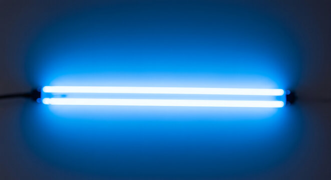 Two parallel, vibrant blue neon tubes against a dark background.