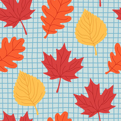 Autumn seamless pattern with hand-drawn red, orange and yellow leaves on a blue irregular checkered background for packaging, textiles, wrapping, greeting cards, seasonal and back-to-school projects