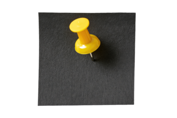 A bright yellow pushpin, head-first, affixed to a dark gray surface