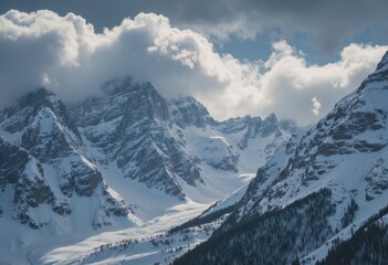 Obraz premium Winter storm clouds gathering over majestic snowy mountains
