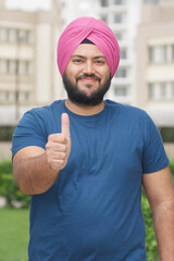 Vertical Photo of Sikh Indian Man Showing Thumbs Up