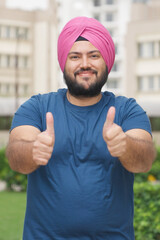 Vertical Photo of Sikh Indian Man Appriciating with Thumbs Up