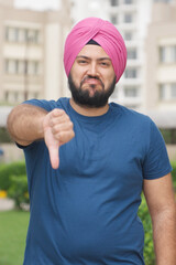 Vertical Photo of Sikh Indian Man Showing Thumbs Down