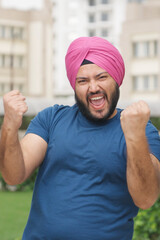 Vertical Photo of Sikh Indian Man Celebrating