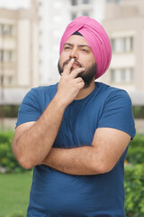 Vertical Photo of Sikh Indian Man Thinking
