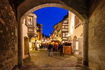 Atmospheric View Through the City Gate of Stein am Rhein onto the Festively Lit Christmas Market at...