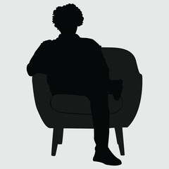 silhouette of a man sitting on sofa 