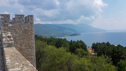 Naklejka premium Stone Castle Tower Overlooking Coastal Landscape