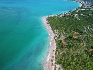 Aerial view from Praia dos Carneiros, Pernambuco: turquoise sea, white sandy beach, endless palm...