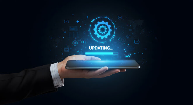 Software system update concept with business person holding phone showing technology installation progress bar for application and maintenance