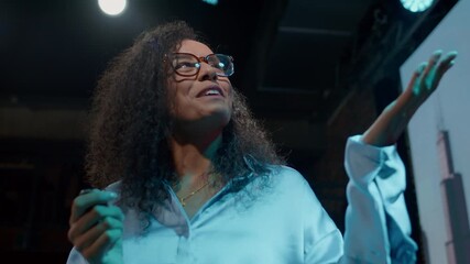 Businesswoman on stage talking and presenting