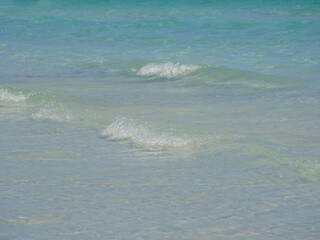 Waves close up background. The beach Spiaggia La Cinta in San Teodoro, Olbia, Sardinia