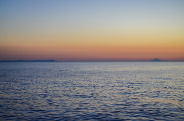 Distant Islands at Twilight Over Tranquil Sea