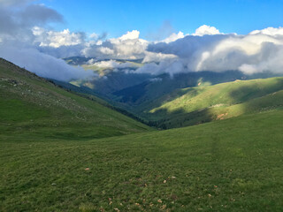 Sunlight and Clouds Over Mountain Valley