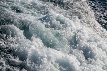 Close-up of Turbulent Water and Foam from a Ship's Wake