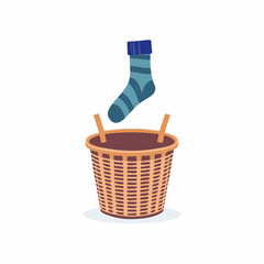 Laundry basket with sock jumping out &ndash; Woven basket mid-topple as a sock springs free.
