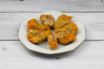 Pumpkin or Zucchini Flowers Dolma Stuffed with Rice Pilaf . Turkish Food in Plate. Traditional Organic Food.